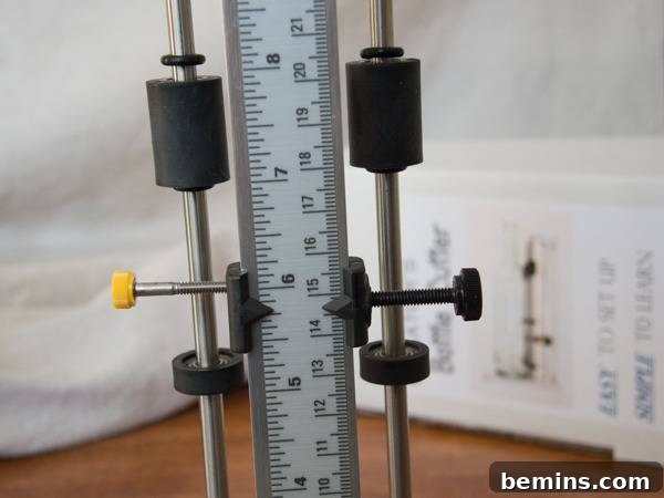 Which Bottle Cutter Reigns Supreme? A Definitive Review 36 A white yard stick with a clamp at 5' 15/16