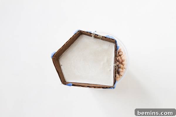 DIY Geometric Concrete Bookends from Recycled Cardboard 12 Concrete inside a cardboard mold.