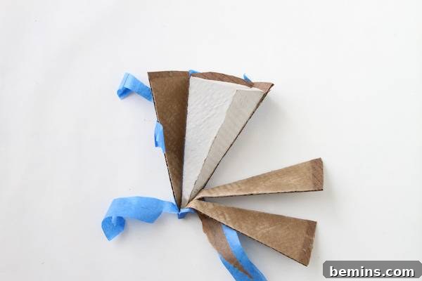 DIY Geometric Concrete Bookends from Recycled Cardboard 13 Triangular pyramid with concrete inside.