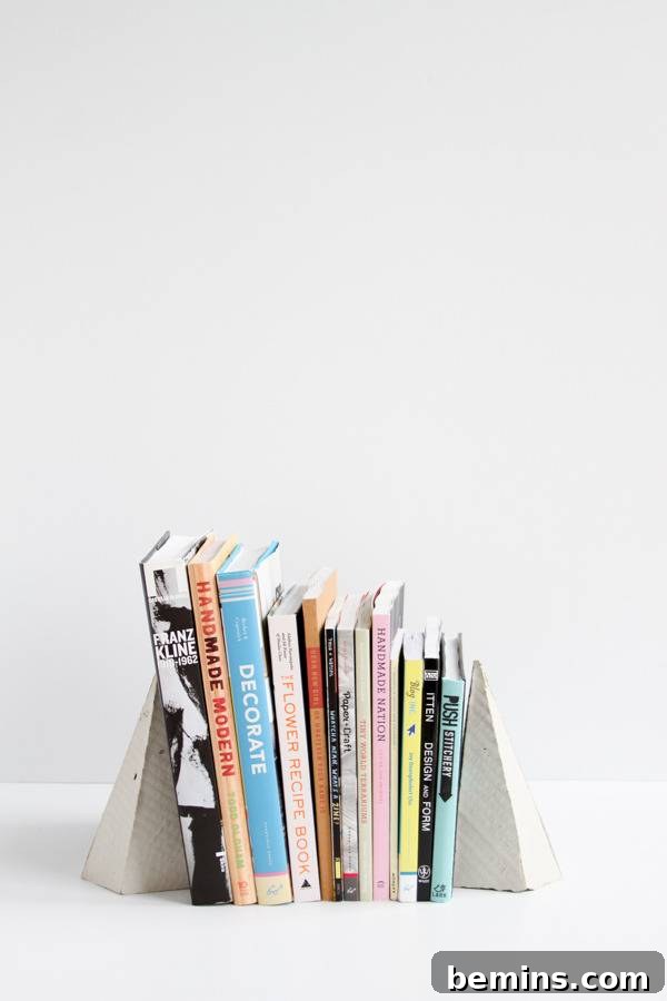 DIY Geometric Concrete Bookends from Recycled Cardboard 18 A stack of books held up by bookends.