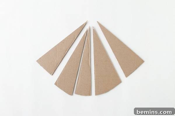 DIY Geometric Concrete Bookends from Recycled Cardboard 6 Brown triangles on a white surface.