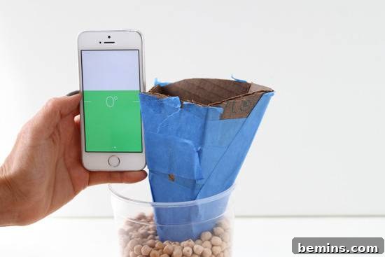 DIY Geometric Concrete Bookends from Recycled Cardboard 10 Cardboard in a plastic container with beans.