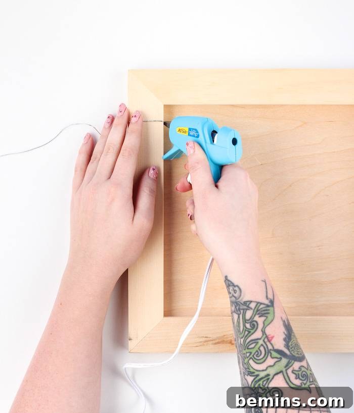 Simple Chic Wood Memo Board 4 Gluing the cord to the wooden panel for the memo board