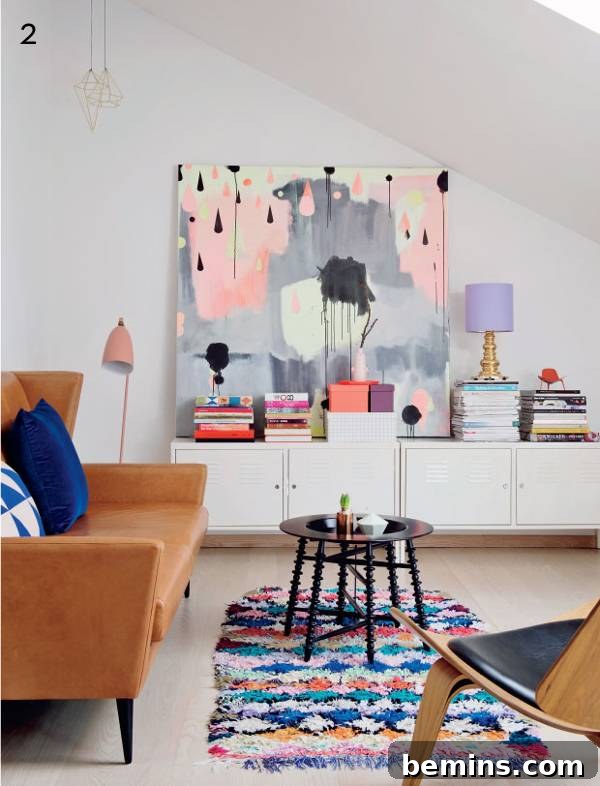 Tan furniture on a rug in a pastel-themed room.
