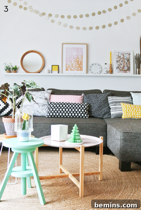 L-shaped gray couch with colorful pillows in a pastel room.