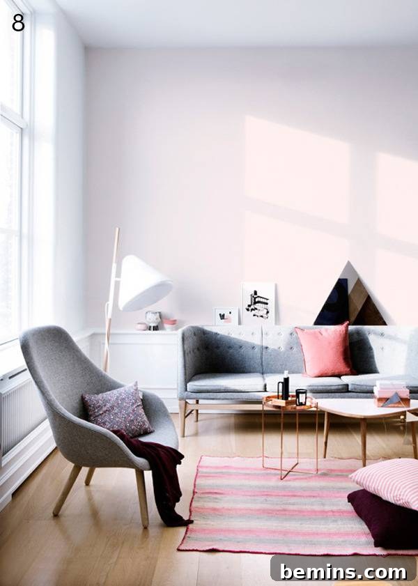 Living room with sofa, chair, and rug.