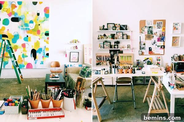 Art studio with wooden benches, paintings, and art supplies. Lisa Congdon's studio is a vibrant and eclectic space.