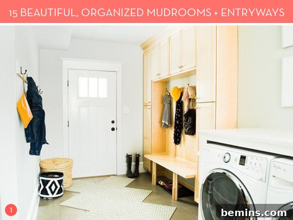 A mudroom with pale peach cupboards above a bench and a washer and dryer, showcasing an organized and functional space.