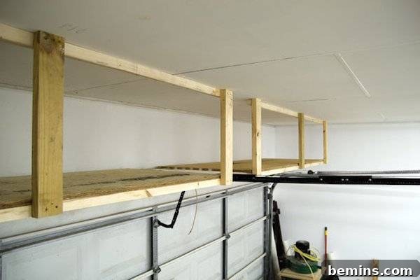 Two empty wooden racks installed near the roof of the garage, demonstrating how to utilize overhead space for storage.