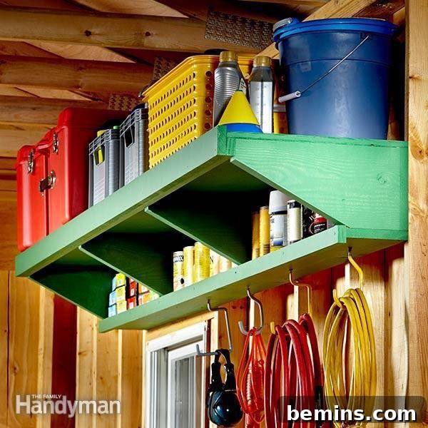 Items hanging on a wall and from a green shelf in a shed, showcasing a well-organized storage system.