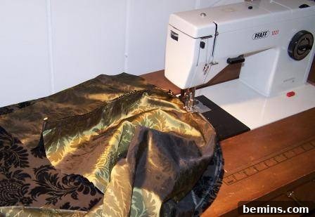 Upcycled Wooden Spool Ottoman in Light Green 6 Sewing machine with fabric
