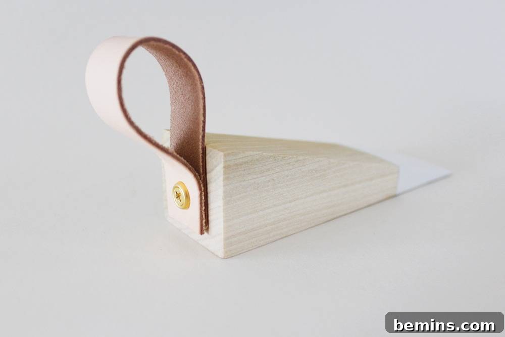 Wood and leather doorstop