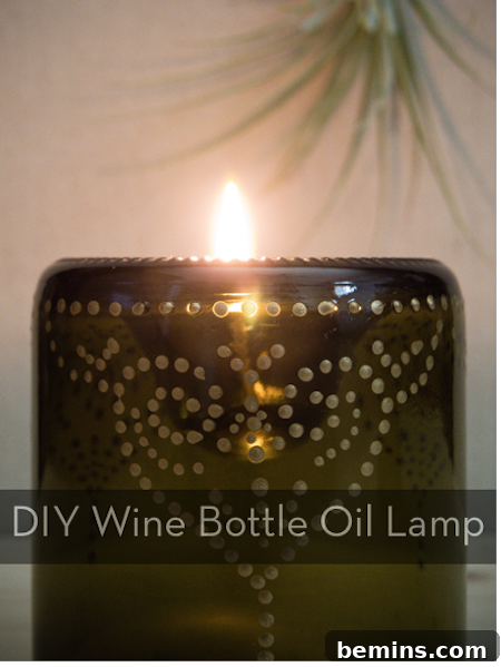 Craft an Elegant Inverted Wine Bottle Oil Lamp 2 A beautifully crafted wine bottle transformed into an oil lamp, casting a warm, inviting glow. The lamp features an intricate, dotted metallic design.