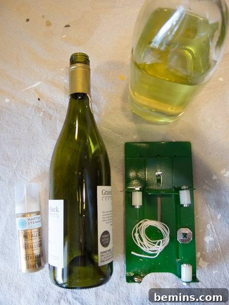 Craft an Elegant Inverted Wine Bottle Oil Lamp 4 A neat arrangement of all the required tools and materials for the DIY oil lamp project, including a wine bottle, glass cutter, paints, and wick supplies.