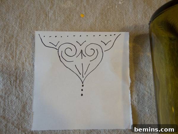 Craft an Elegant Inverted Wine Bottle Oil Lamp 5 A hand-drawn abstract pattern on white paper, prepared as a template for decorating the glass oil lamp.