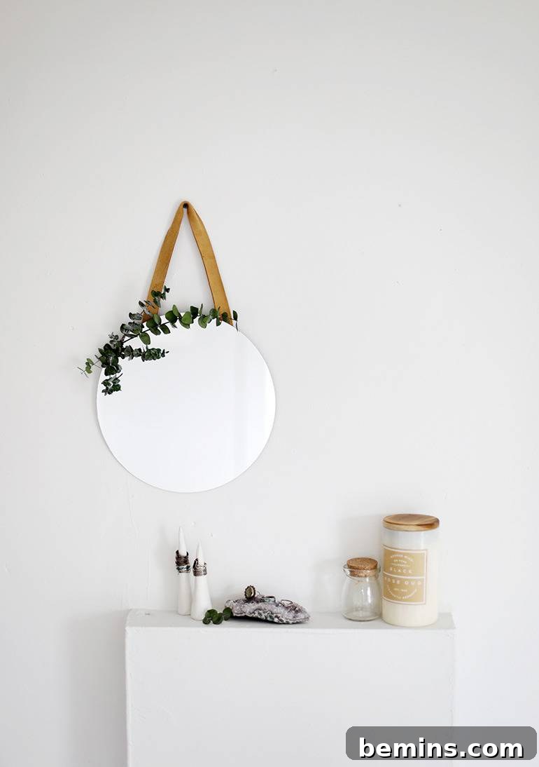 A DIY leather mirror adding a rustic and elegant touch to a room.