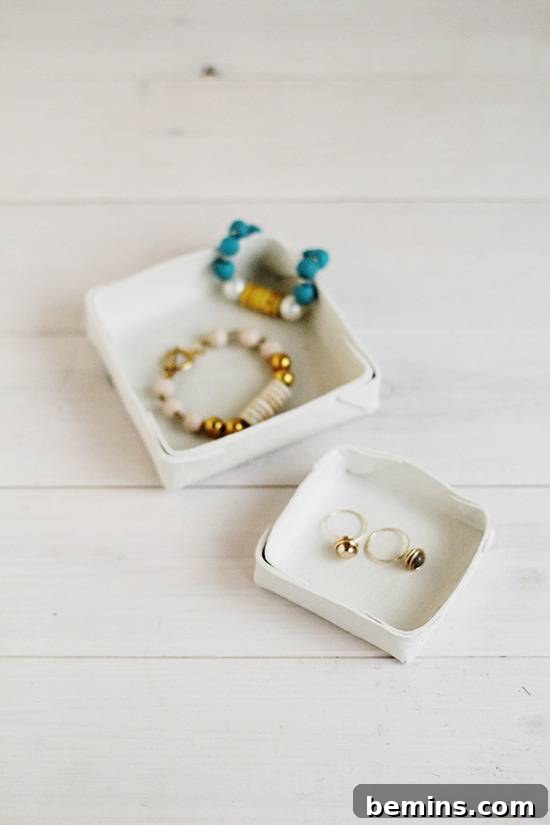 A folded clay jewelry dish adding a stylish and functional touch to a dresser or vanity.