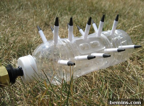 DIY sprinkler made from a plastic bottle and pens