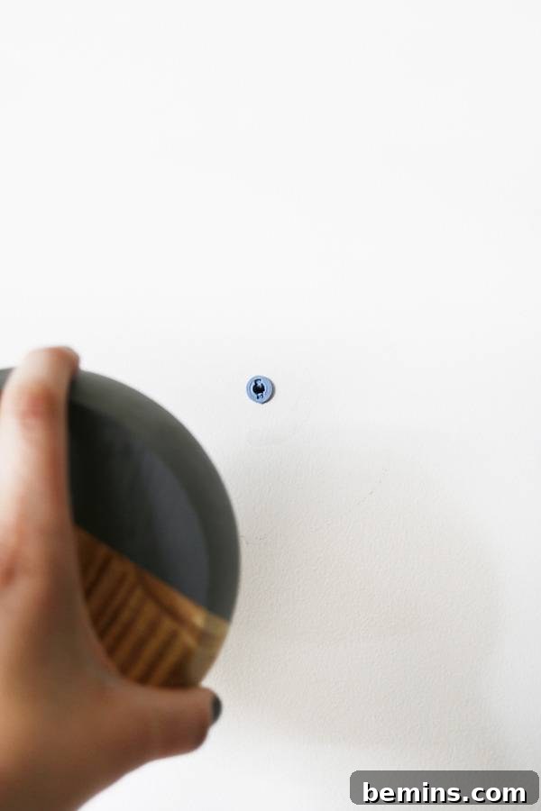 Mounting the coat hanger on the wall