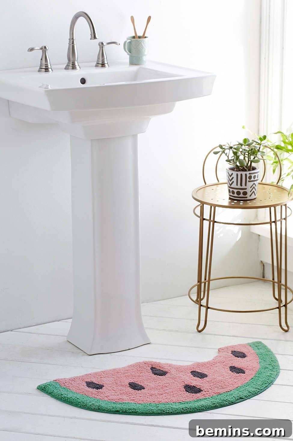 Watermelon bath mat in front of a white bathroom sink