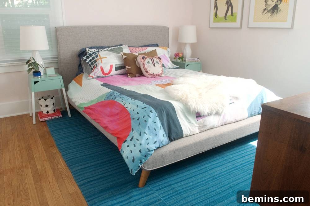 A colorful, inviting master bedroom with bright linens and decorative pillows.