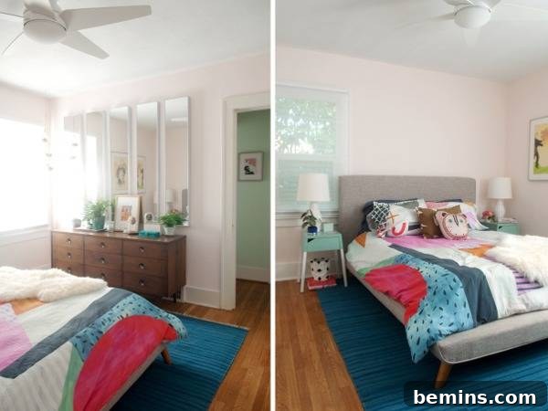 A rose colored bedroom with a cozy bed and large mirrors reflecting light.