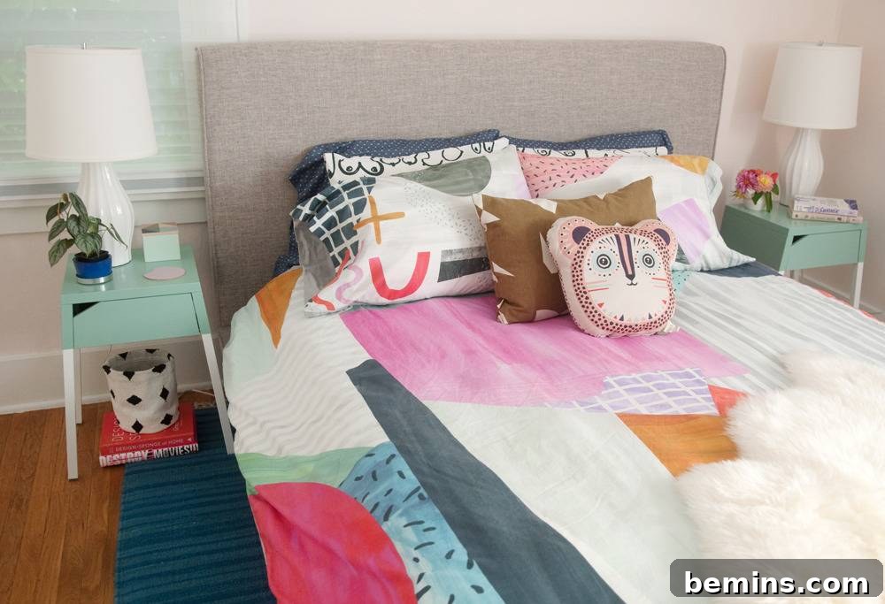Colorful sheets and a blue rug create a vibrant and inviting bedroom space.