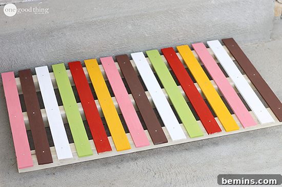 Vibrant DIY Doormats: Welcome Summer with Color 9 DIY Wood Plank Doormat - Modern and Stylish Entryway