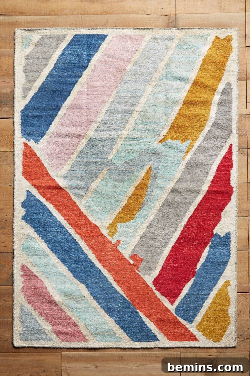 From Bland to Brilliant: 13 Colorful Bedroom Decor Ideas 12 A colorful brushstroke rug from Anthropologie brightens up the room and adds an artistic touch to the flooring.