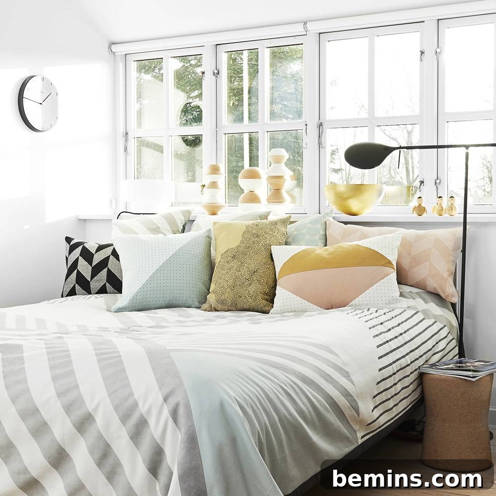 From Bland to Brilliant: 13 Colorful Bedroom Decor Ideas 14 Colorful bed pillows from OYOY add a playful and inviting touch to a cozy bedroom setup.