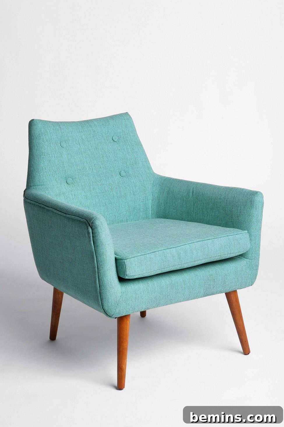 From Bland to Brilliant: 13 Colorful Bedroom Decor Ideas 15 A teal chair from Urban Outfitters adds a pop of color and comfortable seating to a bedroom sitting area.