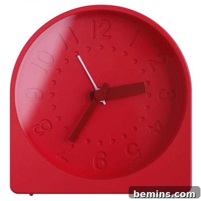 From Bland to Brilliant: 13 Colorful Bedroom Decor Ideas 5 A classic red bell alarm clock adds a retro touch and a pop of color to any bedside table.