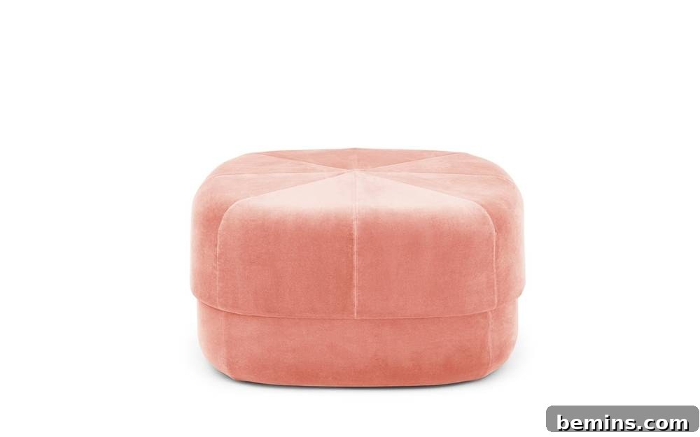From Bland to Brilliant: 13 Colorful Bedroom Decor Ideas 9 A pink velour pouf from Normann-Copenhagen provides comfortable seating and a playful touch to any bedroom setting.