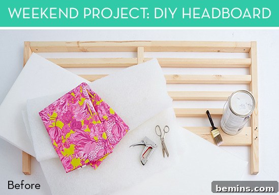 Fabric and tools laid out on a white sheet ready for a DIY upholstered headboard project.