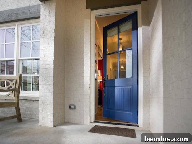 An open blue door leading into a porch, creating an inviting and serene entrance.