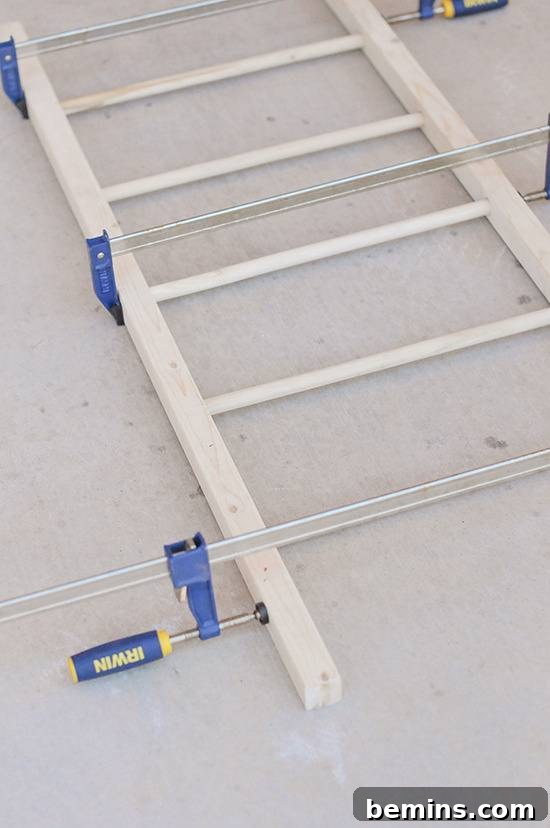 DIY Vertical Succulent Garden from an Old Ladder 6 Drilling Holes for Dowels in the Ladder