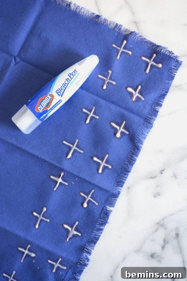DIY Bleach Stenciled Geometric Napkins 5 A blue napkin and a bleach pen