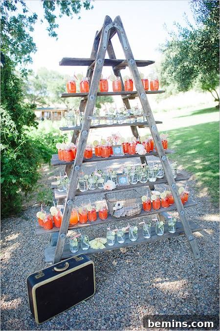 Colorful candles are on a pyramid shaped stand.