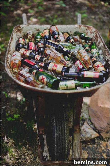 Drinks are being served out of a wheelbarrow outside.
