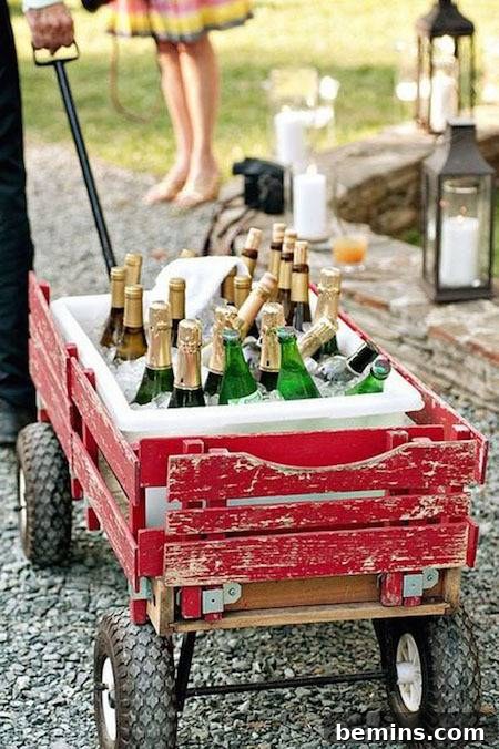 A person hauls wine in a little red wagon.