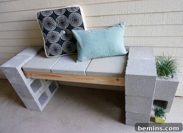 A bench outdoors is made of cinder blocks and wood.