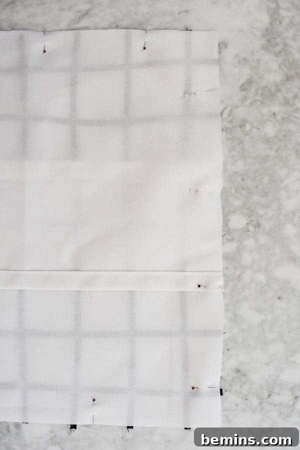 Stylish Geometric Pillows Easy DIY Guide 14 Close-up of a sewing machine stitching the final seam around the geometric pillow cover, demonstrating precision and craftsmanship.