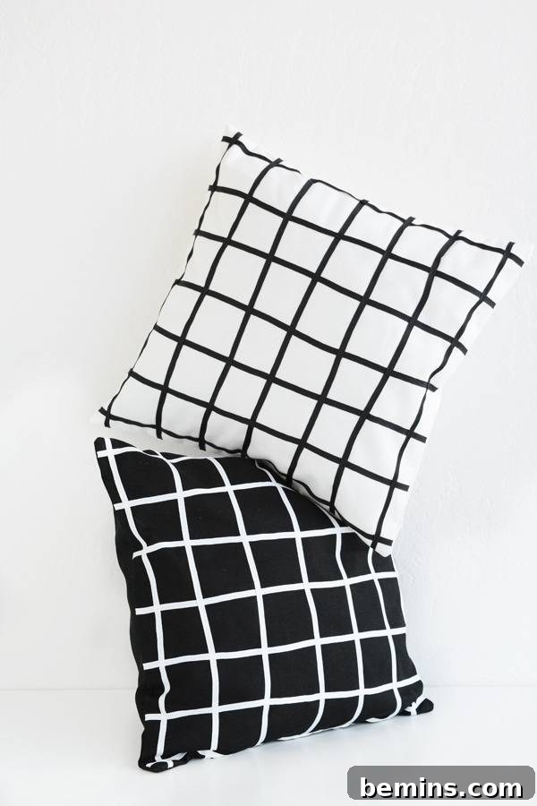 Stylish Geometric Pillows Easy DIY Guide 5 A collection of monochrome geometric grid pillows arranged on a surface, demonstrating versatility in modern home styling.