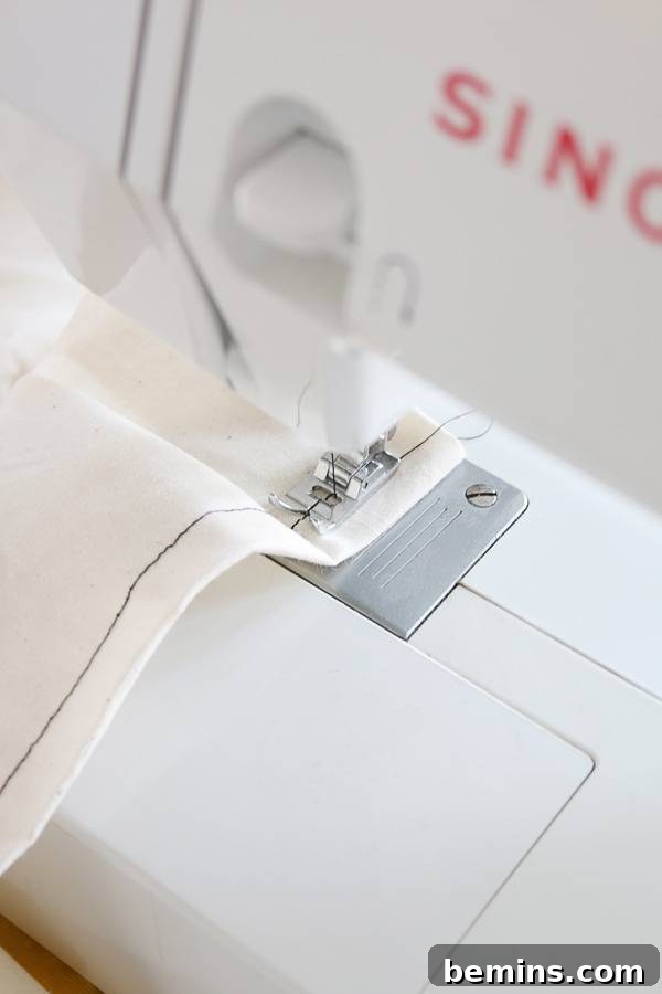 Budget-Friendly Boho Chic Textile Art 6 Sewing the hem of the fabric