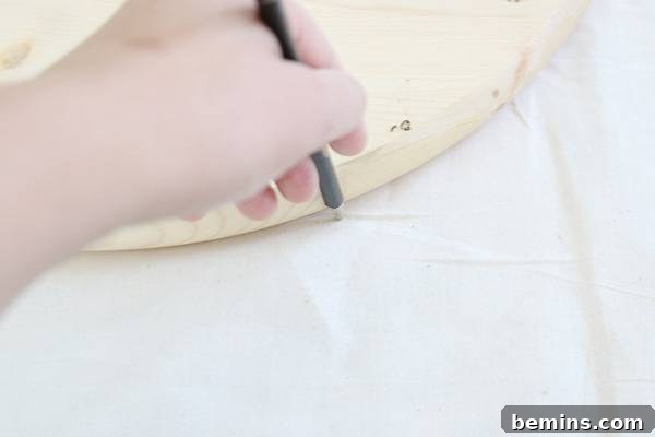 Budget-Friendly Boho Chic Textile Art 7 Tracing circles on the fabric