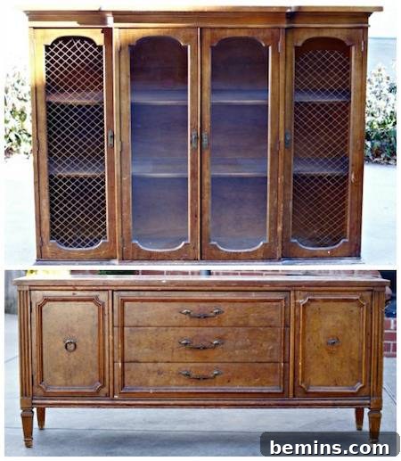 A tall brown sideboard cabinet featuring four oval doors and two shelves on the top portion.