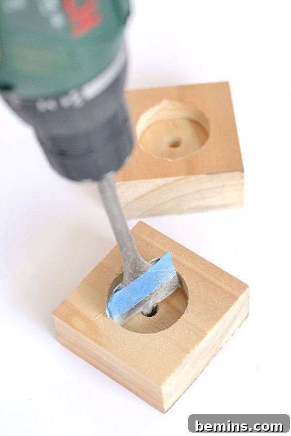 Sanding the wood squares for tea light holders