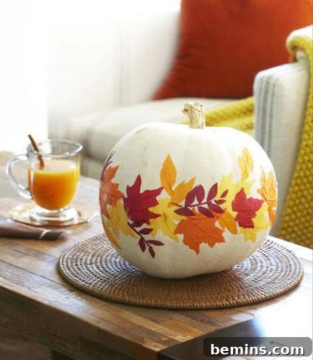 A pumpkin decorated with a yellow and red leafy pattern, creating a festive and elegant fall accent.