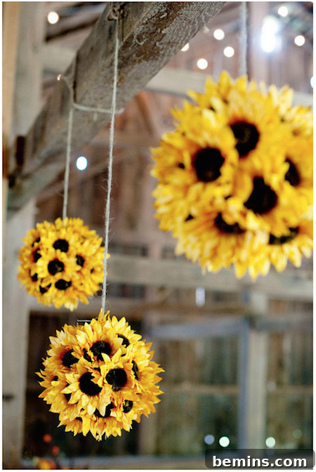 Yellow and brown sunflowers dangling from strings, creating a cheerful and vibrant fall display.