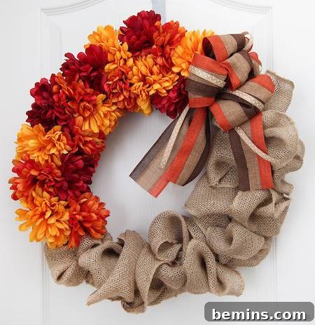Handmade art mixed with golden flowers and a tissue silk cloth, creating an elegant and festive fall display.